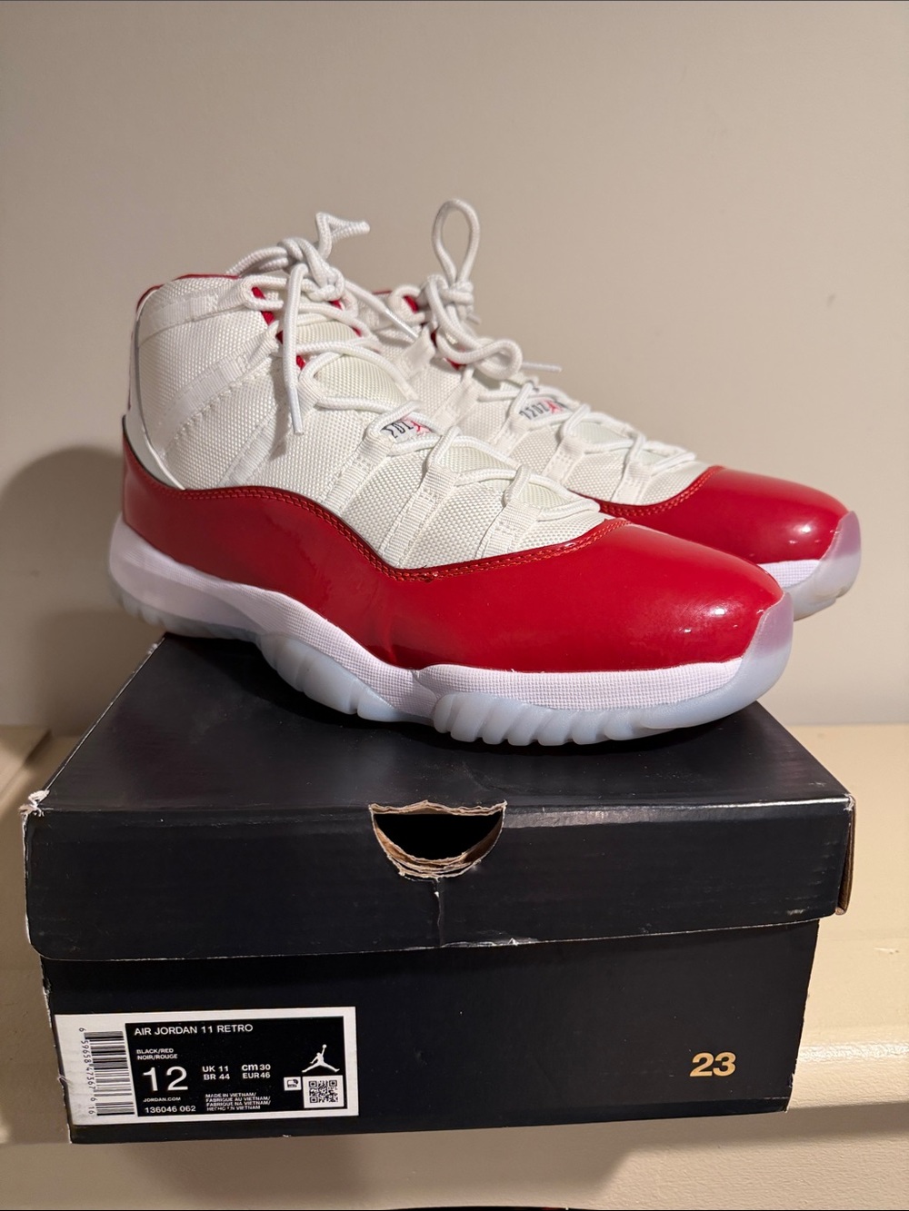 Jordan White and Red Retro 11 Athletic Sneakers